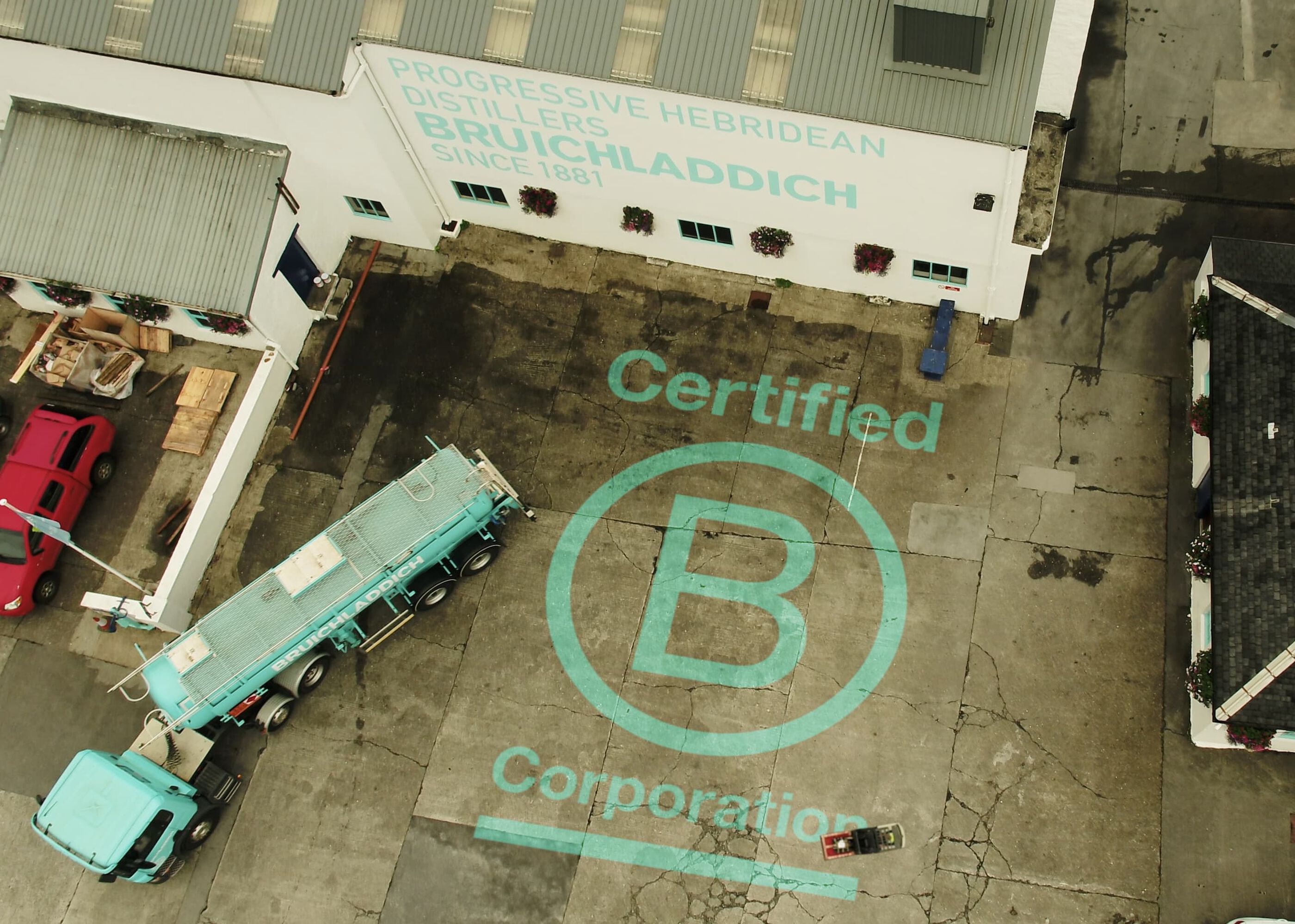 Overhead image of a truck pulling away from the Bruichladdich Distillery